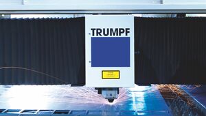 The laser beam cuts out a desired shape from steel controlled by a computer